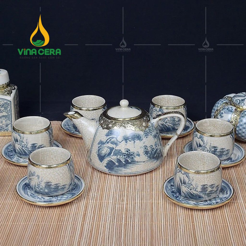 bo-am-tra-men-ran-boc-dong-dang-chuong-quai-su-hoa-tiet-son-thuy (1) Bộ ấm trà men rạn bọc đồng dáng chuông quai sứ họa tiết sơn thủy