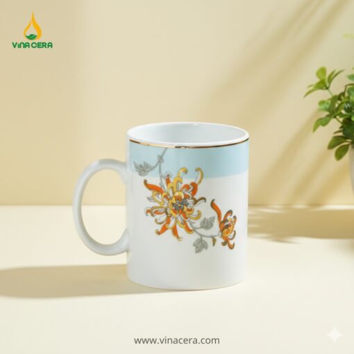 Cốc Sứ Quai C Hoa Bỉ Ngạn Viền Vàng In Logo – Gốm Sứ Bát Tràng Quà Tặng Doanh Nghiệp