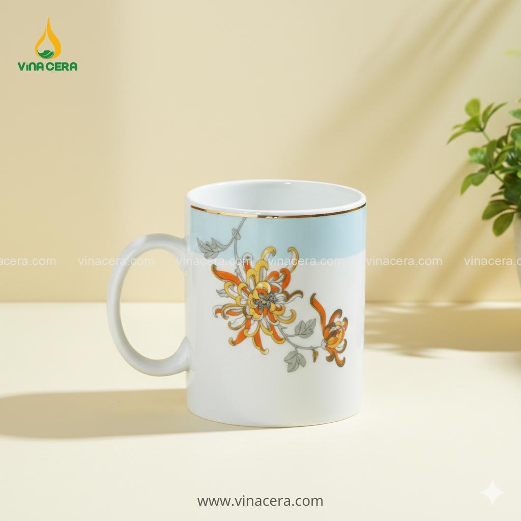 Cốc Sứ Quai C Hoa Bỉ Ngạn Viền Vàng In Logo – Gốm Sứ Bát Tràng Quà Tặng Doanh Nghiệp