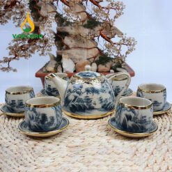 Bộ ấm trà men rạn bọc đồng dáng chuông quai sứ họa tiết sơn thủy