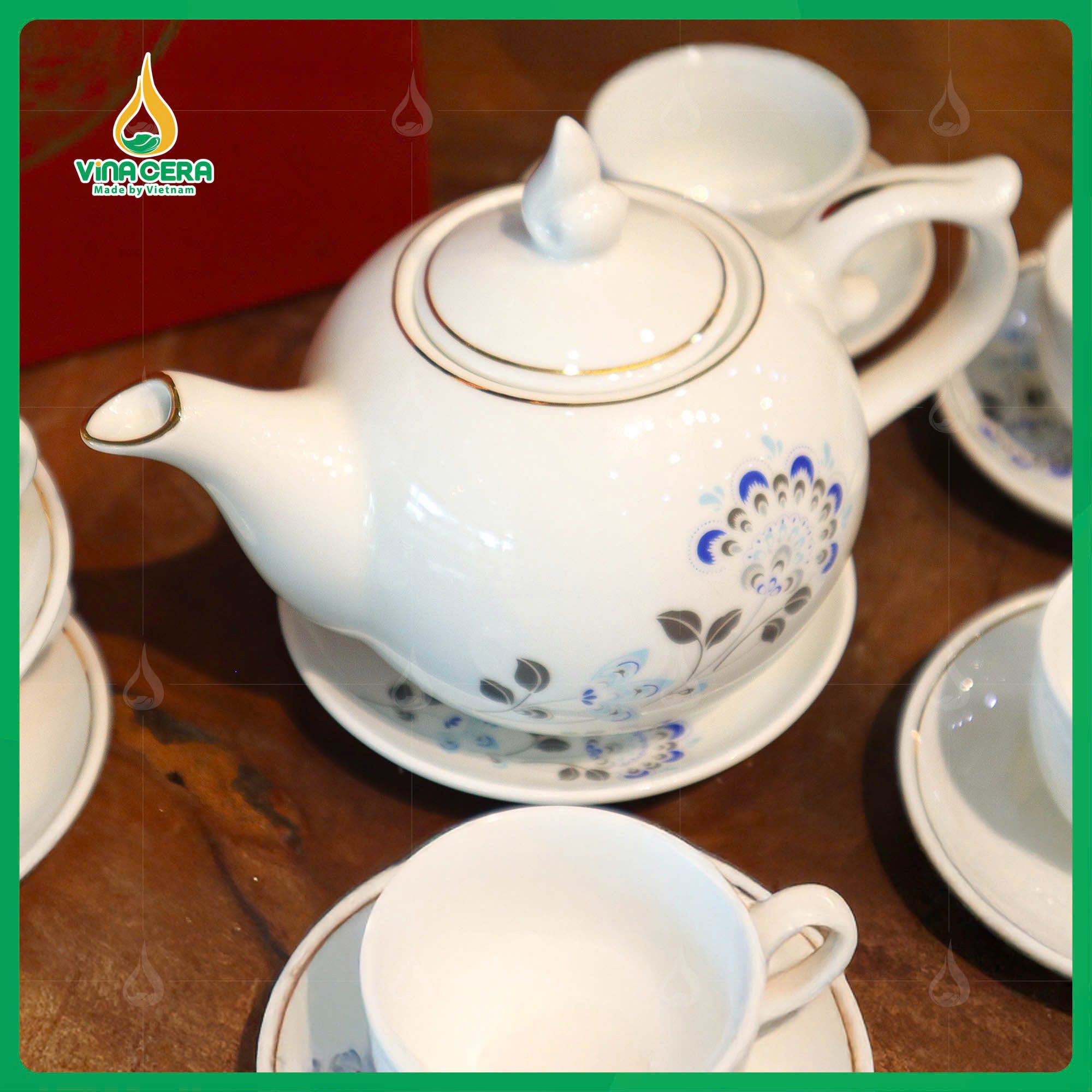 Bộ Ấm Chén Dáng Bưởi Chóp Ngọn Lửa In logo Đại Hội Đảng (1) Bộ Ấm Chén Dáng Bưởi Chóp Ngọn Lửa In logo Đại Hội Đảng