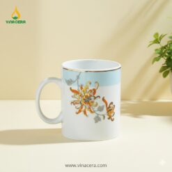 Cốc Sứ Quai C Hoa Bỉ Ngạn Viền Vàng In Logo – Gốm Sứ Bát Tràng Quà Tặng Doanh Nghiệp